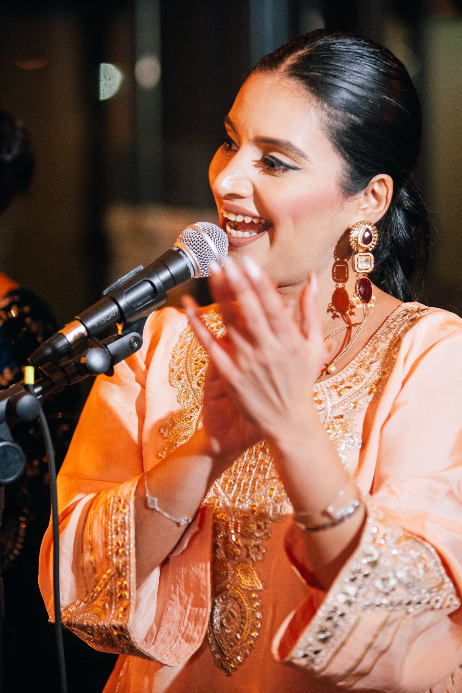 Surleena Singh singing at a live performance